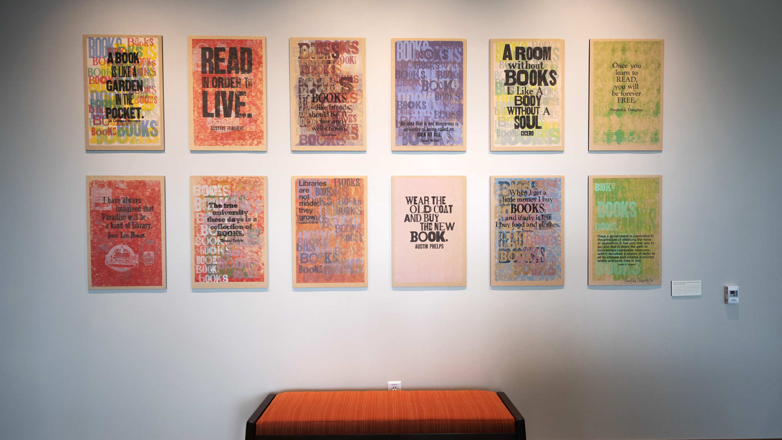 colorful rectangles on wall each featuring a quote from a book