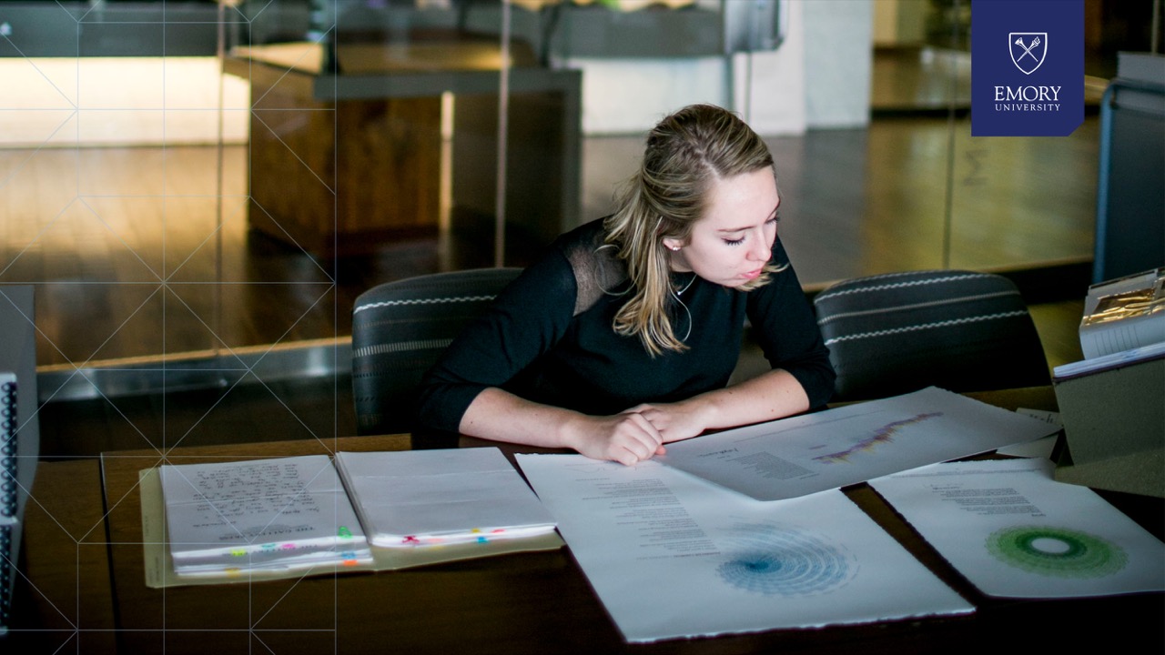 student studying at a table in the rose library